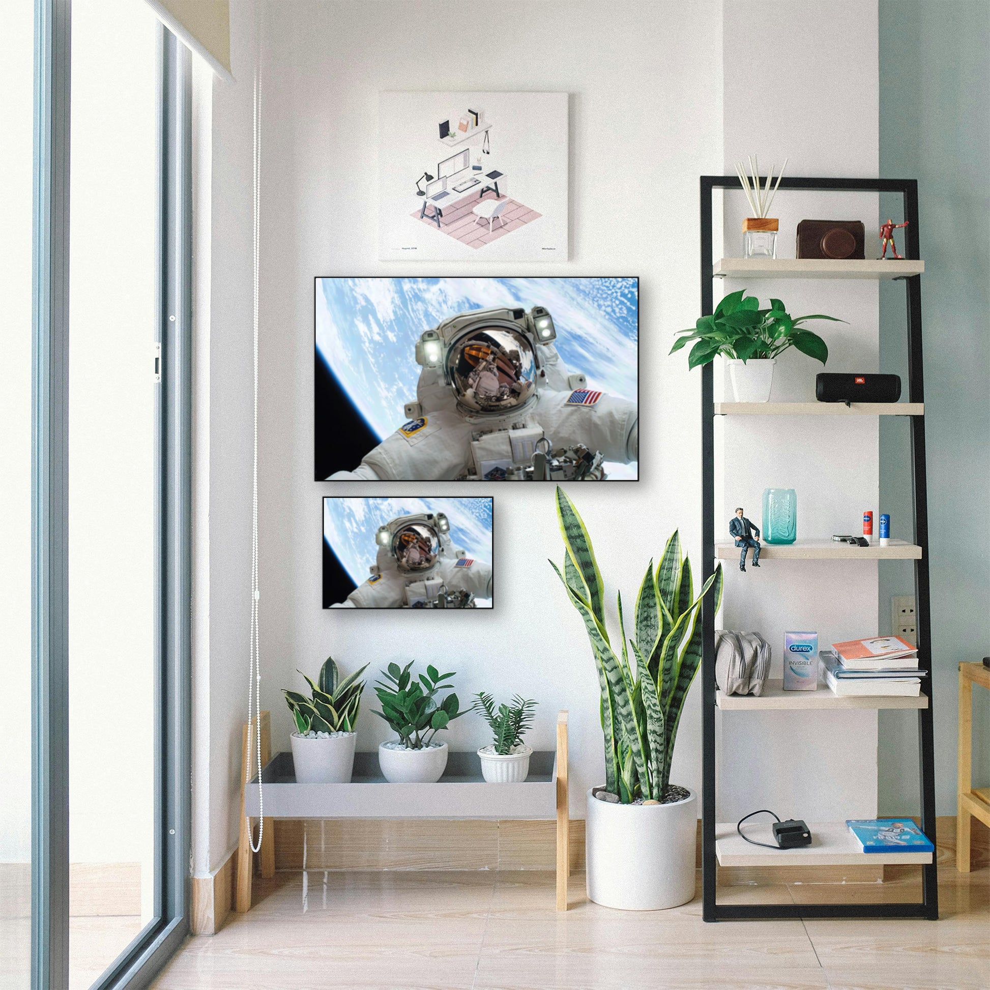 Outer Space Selfie Wall Art – Astronaut Floating Over Earth displayed in bright room with plants and shelf