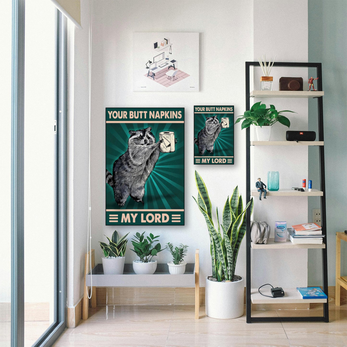 Funny Raccoon Bathroom Poster – “Your Butt Napkins, My Lord” Wall Art displayed in bright room with plants and shelf